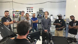 Detailer Danny Grenier of Auto-Chem teaching students how to maximize quality and efficiency in the detailing department.