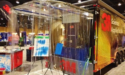 The back of the 3M DEMO trailer features a fully functional paint booth. Other parts of the DEMO trailer offer similar functions in regards to different tools, allowing repairers to try out equipment in real applications.