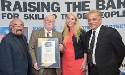 John Norris holding the OCOT Prize of Excellence. From left: David Tsubouchi (Registrar & CEO), John Norris, Catherine Poultney (Chair , Motive Power Divisional Board) and Pat Blackwood (Chair, Board of Governors)
