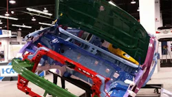 Various metals, including aluminum (green), magnesium (yellow), and press-hardened ultra-high-strength steel (maroon) can be seen on the 2017 Chrysler Pacifica at NACE 2016. Also visible is the composite front structure (red). (Photo by John Huetter/Repairer Driven News)
