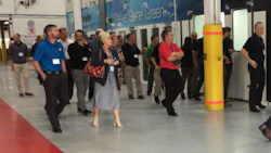 Members of the Coyote Group tour Budds' Collision in Oakville, Ontario. The facility received the Coyote Group Shop of the Year award at the previous meeting in Palm Springs.