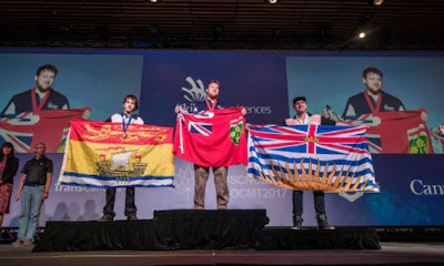 Colin Bailey (centre), the winner of the the 2017 Skills Canada competition Gold medal for autobody repair in the Post-Secondary category, will be one of the first recipients of the new bursaries provided by the Sam Piercey Foundation.