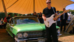 Jimmy Vaughan standing beside his ’61 Cadillac Coupe De Ville. He will be one of the stars featured at SEMA’s Industry Awards Banquet this November.