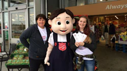 Craftsman Collision staff and Salvation Army mascot Sally Ann at this year's food drive. In total, the event raised $33,944.70 in donations this year.