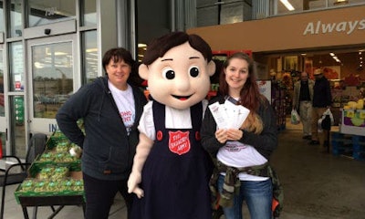 Craftsman Collision staff and Salvation Army mascot Sally Ann at this year's food drive. In total, the event raised $33,944.70 in donations this year.