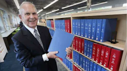 Auto dealer Bill Chisholm at the grand opening of the William F. Chisholm library branch in Windsor, Ontario. The new branch serves as the home for a truly massive collection of automotive history, including original service manuals for the Ford Model T and other vintage vehicles.
