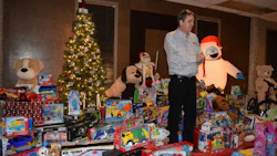 The annual Christmas party gathered more than 200 toys for the charity, as well as the $1,000 dollars raised from its silent auction.