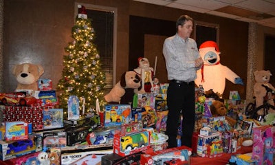 The annual Christmas party gathered more than 200 toys for the charity, as well as the $1,000 dollars raised from its silent auction.