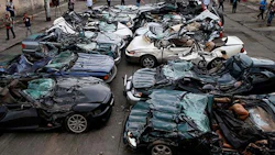 A pile of crushed luxury vehicles in the Philippines.