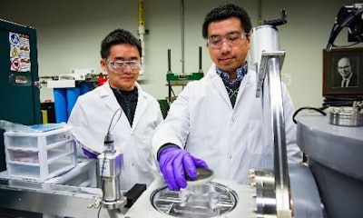 Sichuang Xue (left) Purdue postdoctoral research associate and Qiang Li (right), Purdue doctoral student preparing a sample to create super-strong aluminum alloys (image courtesy of Purdue).