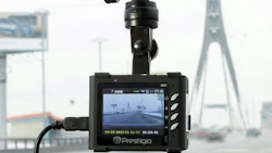 A dashboard camera on the inside of a vehicle’s windshield.