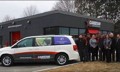 The CARSTAR Peterborough team with the van they donated to Big Brothers Big Sisters.