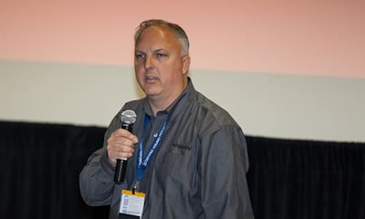 Mark Zoba speaks at a conference. Nissan has recently announced that it will add and improve partnerships between key industry people.
