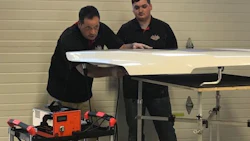 Domenic Serra, owner of PDR Canada, demonstrates the electronic dent repair machine.