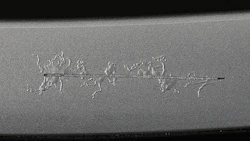 Filiform corrosion spreading from scribe on painted aluminum.