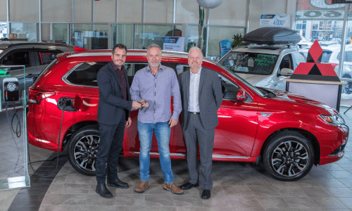 Serge McGraw (centre) chose Mitsubishi’s Outlander PHEV for its load capacity and its ability to run on 100 per cent electric. He is shown with (left) François Roy, general manager, Québec Mitsubishi, and Marco Sauvageau, sales director, Québec Mitsubishi. Photo courtesy Mitsubishi Motor Sales of Canada.