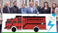 Firefighters_and_city_officials_with_the_City_of_Varennes_pose_with_a_preliminary_drawing_of_E-ONE_Vector_electric_rescue_vehicle