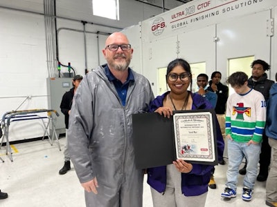 Sarah Mari poses with her brand new spray gun after being named SATA’s student with the most painting promise.