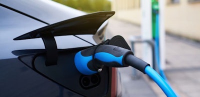 electric car refueling at a charging station