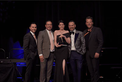Chantal Cox (third from the left) accepts the Leadership Award for 2022.