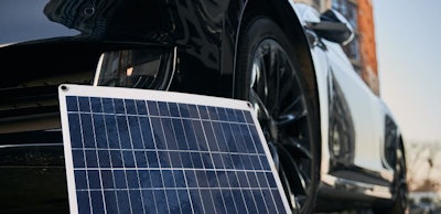 Solar panel and electric car on the street.