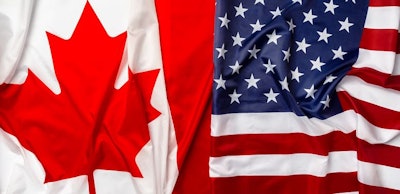 Flags of Canada and USA folded together