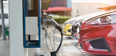 Electric car on electric car charging station. Power supply for