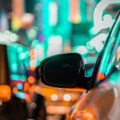 car-and-rear-view-mirror-in-city-traffic-with-ligh-2022-11-04-06-42-28-utc-150×150-1