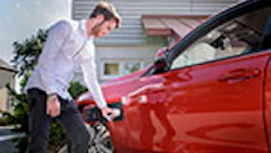 man-charging-ev-red-getty-683735149
