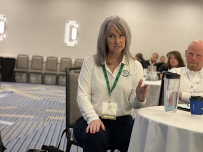 Mary Poirier of Valley Automotive Recyclers addresses the panel from the crowd, advocating for her Pembroke, Ont. family business.