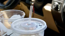 large-empty-soda-cups-in-cars-cup-holder-on-road-t-2022-11-15-12-47-53-utc
