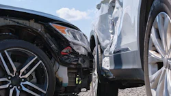 Cars crashed heavily in road accident after collision on city street. Road safety and insurance concept
