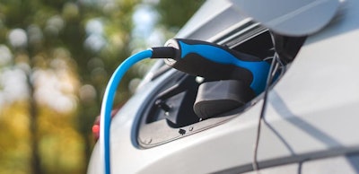 Charging an electric car,sustainable transportation concept.