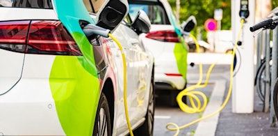Charging battery of an electric car in city.