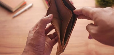 Man hand open an empty wallet with copy space.