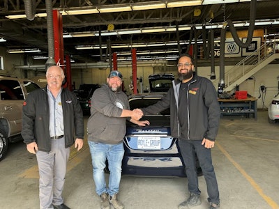 Travis Royle is pictured with Aidan Wornes Associate Dean, School of Trades and Head of Apprenticeship for SLC and Saifullah Sanaye Professor of Automotive Technology and Automotive Program Coordinator. Photo Credit: Kris Ward, St. Lawrence College