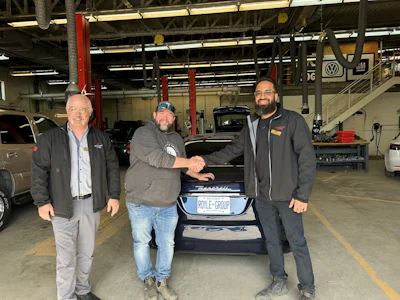 Travis Royle is pictured with Aidan Wornes Associate Dean, School of Trades and Head of Apprenticeship for SLC and Saifullah Sanaye Professor of Automotive Technology and Automotive Program Coordinator. Photo Credit: Kris Ward, St. Lawrence College