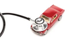 Classic red car with medical stethoscope, symbolizing automotive diagnostic inspection
