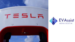 Tesla Supercharger station with red branding against blue sky at EV charging location