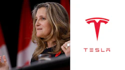 Canadian official speaking at press conference with Tesla logo