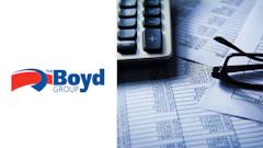 Financial documents, calculator, and Boyd Group logo on accounting spreadsheet