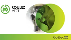 Electric vehicle charging plug connecting to power source, promoting green transportation