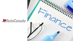 AutoCanada finance notebook with glasses and highlighter on white background
