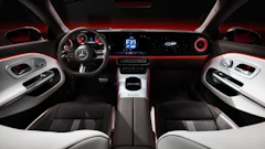 Mercedes-Benz luxury car interior with digital dashboard and red ambient lighting