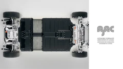 Electric vehicle chassis with battery pack, suspension, and wheels in technical cutaway view
