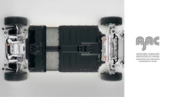 Electric vehicle chassis with battery pack, suspension, and wheels in technical cutaway view