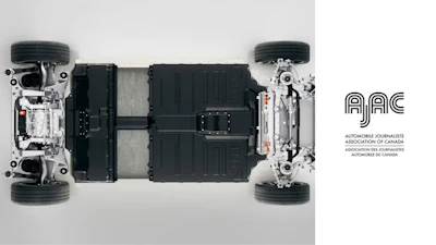 Electric vehicle chassis with battery pack, suspension, and wheels in technical cutaway view