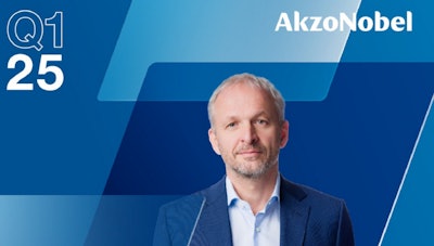 AkzoNobel executive in blue suit against corporate blue gradient backdrop