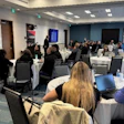 Conference room with professionals attending a business meeting or training event