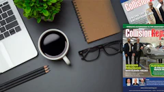 Professional workspace with laptop, coffee, notebook, and collision repair industry magazine